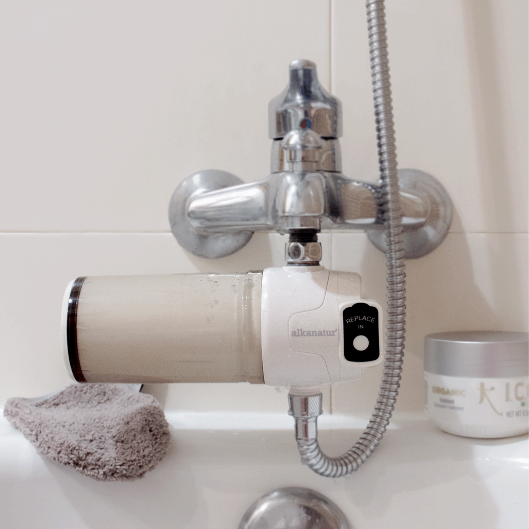 Shower filter Alkanatur being used in the shower